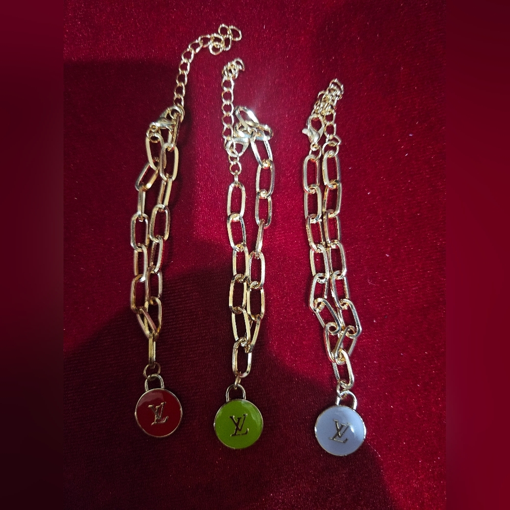 Louis Vuitton Gold Chain Bracelets with Red, Green, and Silver Charms